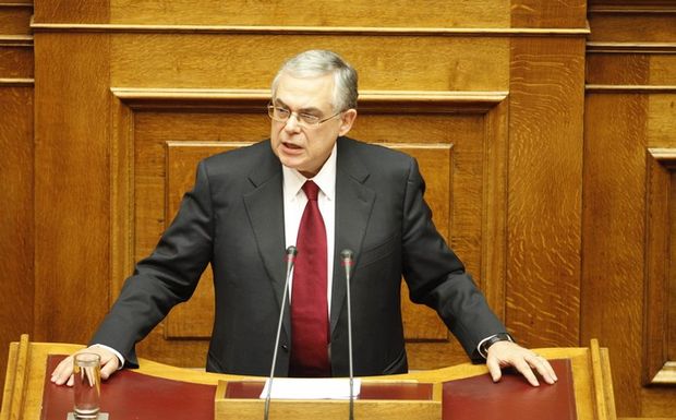 Την ώρα που η Αθήνα καίγεται και οι πόλεις εξεγείρονται, ο Έλληνας Πρωθυπουργός Λ. Παπαδήμος απευθύνει έκκληση προς το κοινοβούλιο για υπερψήφιση του Μνημονίου 2