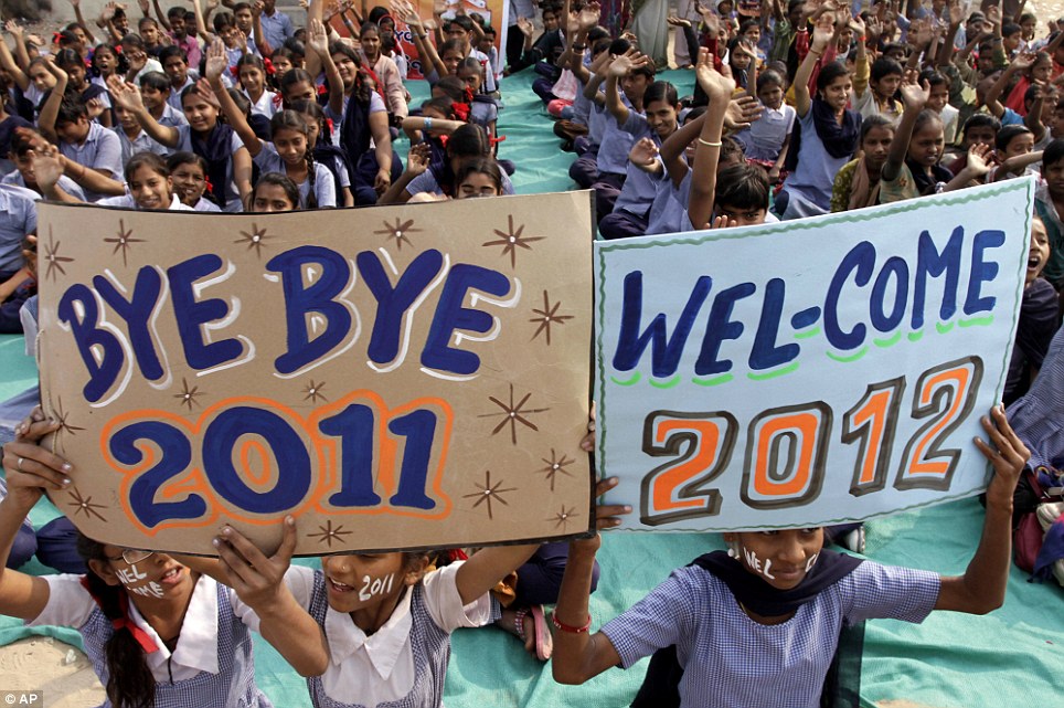 Indian students in Ahmadabad show off placards as they prepare to welcome in the New Year