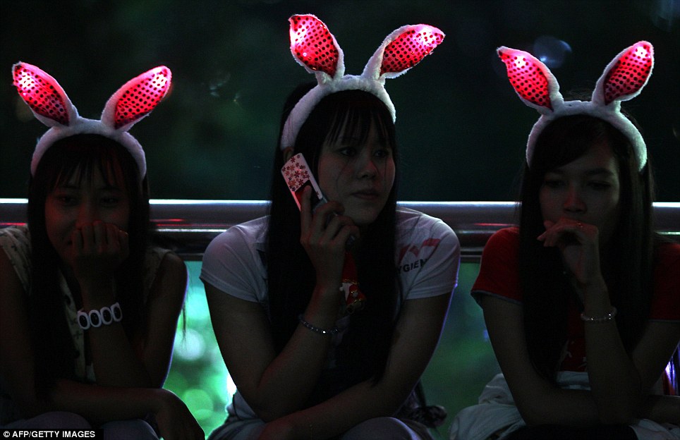 KUALA LUMPUR: Three women, who wore illuminated bunny ears to get into the spirit