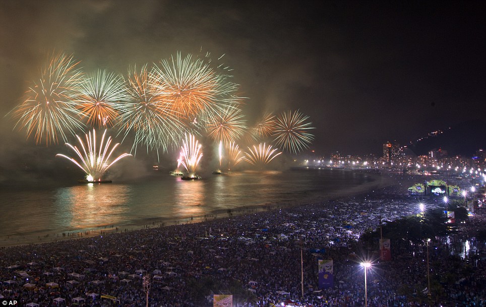BRAZIL: Fireworks explode over Copacabana beach during New Year celebrations in Rio de Janeiro