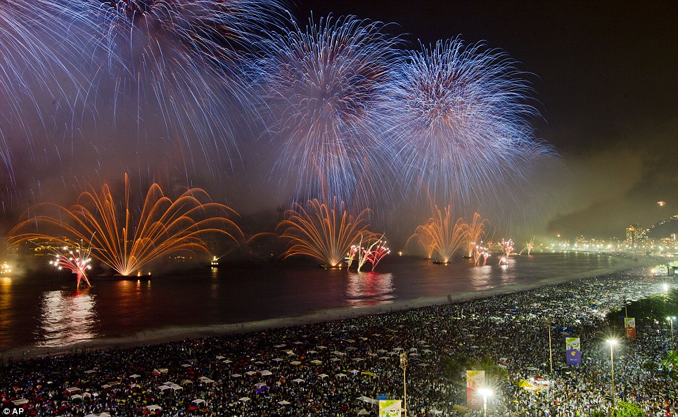 BRAZIL: Fireworks explode over the Copacabana during new year beach celebrations in Rio de Janeiro