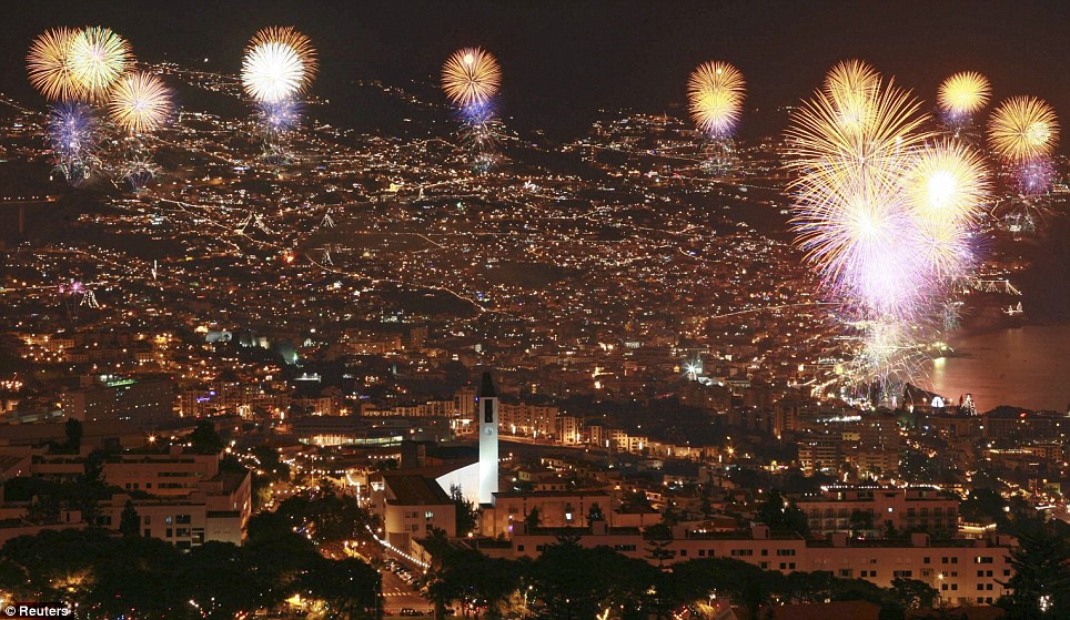 PORTUGAL: Fireworks explode during the year end celebrations over the Funchal city bay in Madeira island