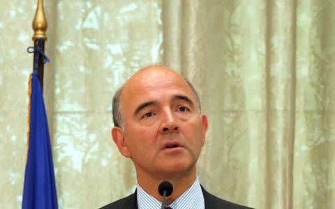 Moscovici Pushes Merkel With Pledge for Greek Debt Relief