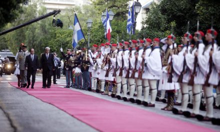 French president visits Athens as Greece seeks debt relief