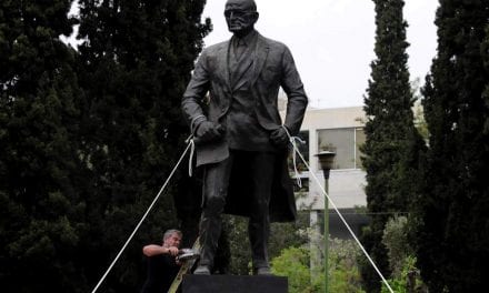 Greek communists attack Harry Truman statue in protest against U.S. airstrikes in Syria